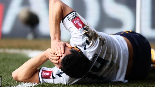 Andros Townsend on the turf in pain after suffering an ACL injury