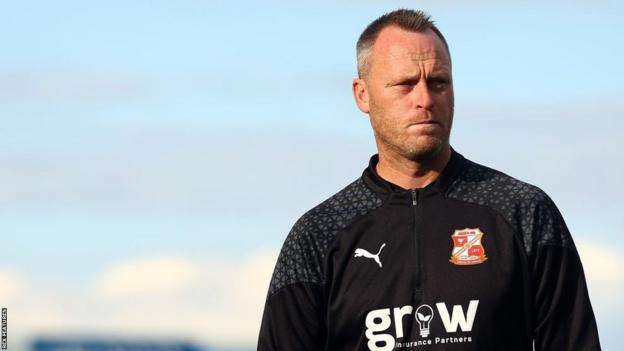 Swindon Town manager Michael Flynn on the touchline during a League Two game.