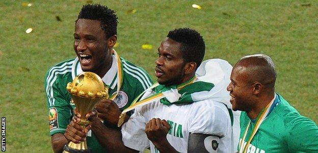 John Mikel Obi (left) and Joseph Yobo (centre) celebrate with the Africa Cup of Nations trophy in 2013