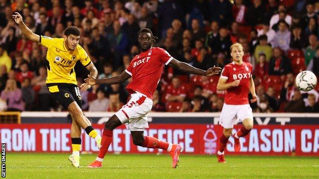 Morgan Gibbs-White of Wolverhampton Wanderers scores his team's fourth against Nottingham Forest in the League Cup