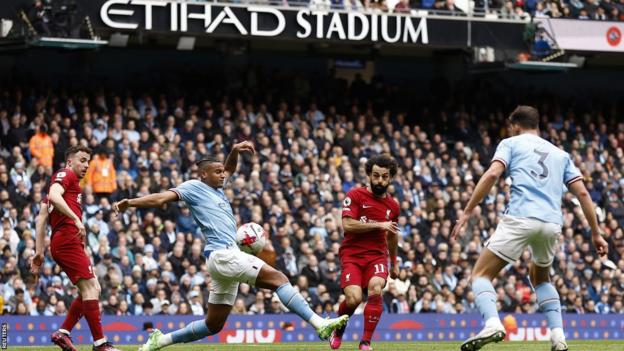 Mohamed Salah scores for Liverpool against Manchester City at Etihad Stadium in the Premier League