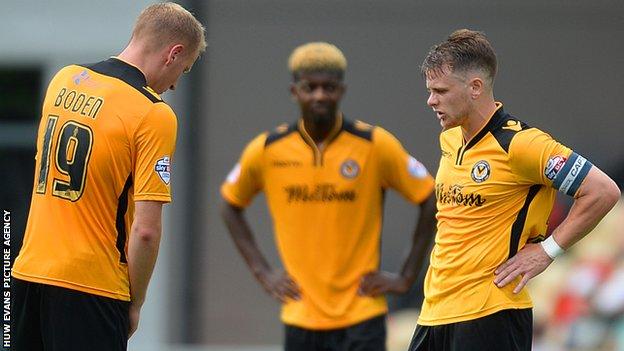 Newport players looked dejected after conceding a third against Leyton Orient