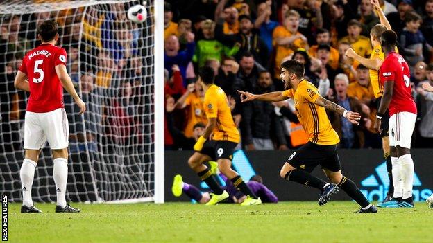 Ruben Neves (second right)