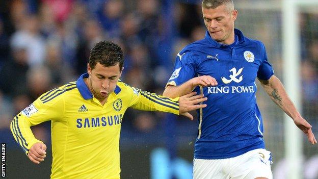 Paul Konchesky (right) keeps tabs on Chelsea's Eden Hazard