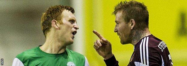 Hibernian's Liam Craig and Ryan Stevenson of Heart of Midlothian exchange words