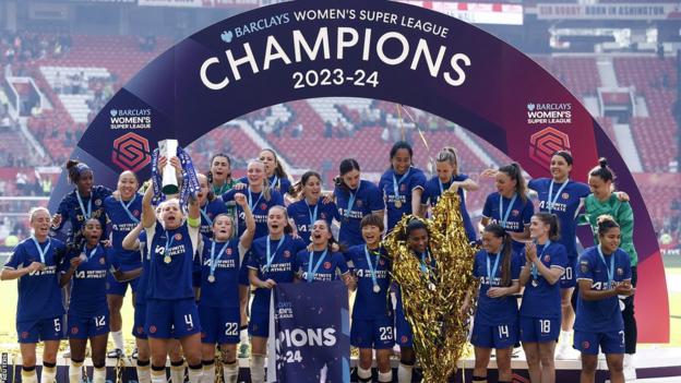 Chelsea celebrate with the Women's Super League trophy