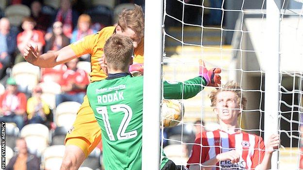 Ryan Bird bundles-in the ball for Newport County against Accrington Stanley