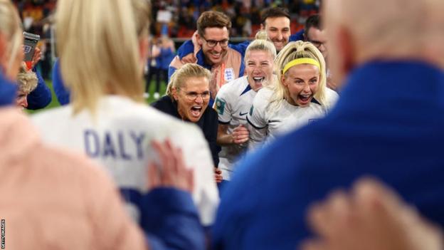 Sarina Wiegman celebrates with players at full-time