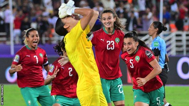 Morocco celebrate at the Women's Africa Cup of Nations after beating Nigeria on penalties