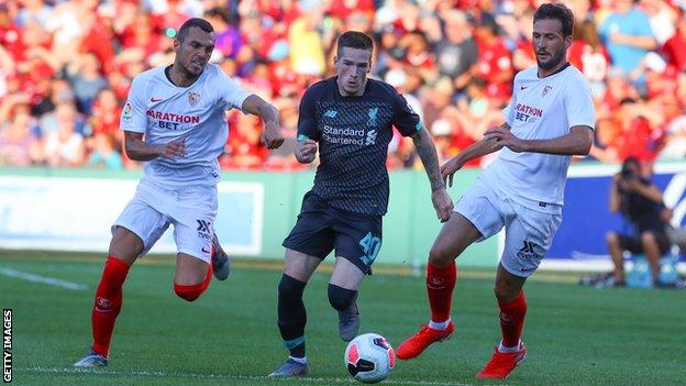 Ryan Kent (centre) in action for Liverpool against Sevilla