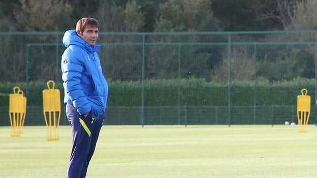 Antonio Conte watches his new Tottenham players in training