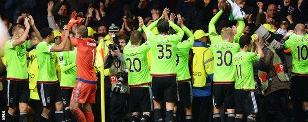 Ajax players celebrate at Celtic Park