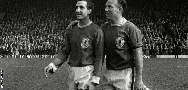 Gerry Byrne and Ronnie Moran celebrate winning the league championship in 1963-64