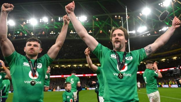 Hugo Keenan and Mack Hansen celebrate Ireland's win over England in Dublin