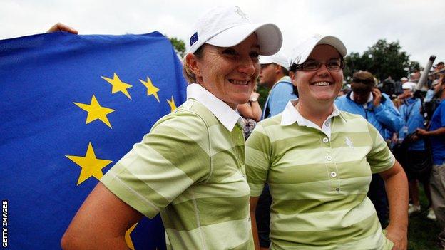 Gwladys Nocera and Becky Brewerton of the European team after defeating Natalie Gulbis and Christina Kim of the US team during the Foursomes matches at the 2009 Solheim Cup