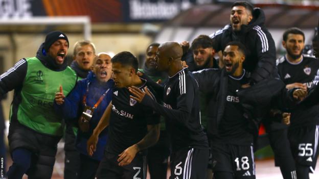 Players from Azerbaijan club Qarabag celebrate a goal against Sporting Braga in the Europa League