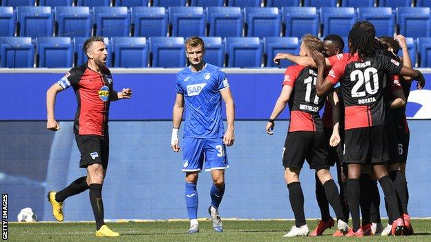 Hertha Berlin players celebrate their opening goal in the win over Hoffenheim