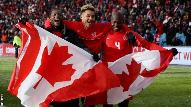 Canada players celebrate after qualifying to the World Cup