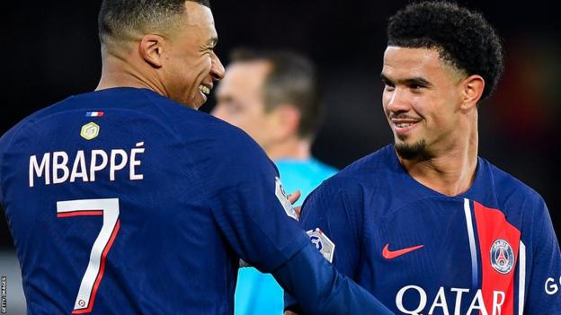 Kylian Mbappe and Warren Zaire-Emery celebrate while playing for Paris St Germain