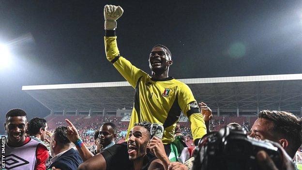 Jesus Owono celebrates Equatorial Guinea's penalty win over Mali