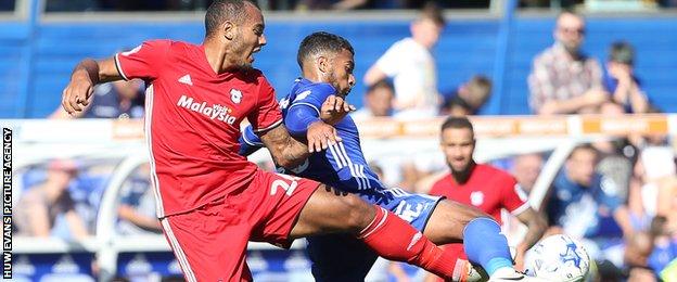Cardiff City's Kenneth Zohore is tackled by Reece Brown