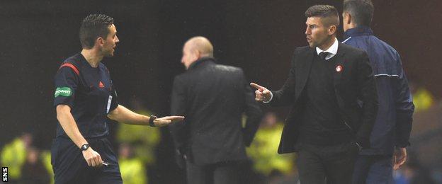 Referee Andrew Dallas and Mark Burchill exchange words at Ibrox