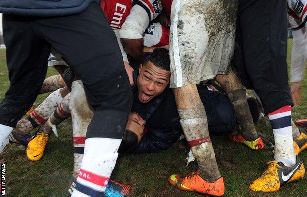 Serge Gnabry celebrates a victory over Inter Milan with his Arsenal Under-19 team-mates in March 2013