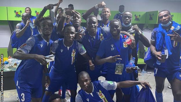Central African Republic players celebrate their win over Nigeria in the changing room