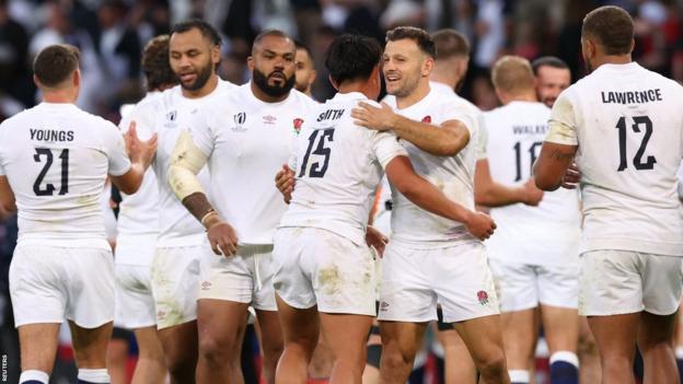 England's players celebrate a win at the Rugby World Cup