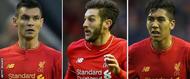 Liverpool football players Dejan Lovren, Adam Lallana and Roberto Firmino
