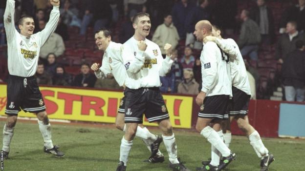 Wrexham celebrate Kevin Russell's goal at Upton Park