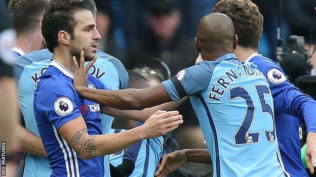 Chelsea midfielder Cesc Fabregas and Manchester City's Fernandinho