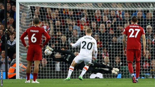 Liverpool keeper Allison saves a penalty taken by West Ham's Jarrod Bowen
