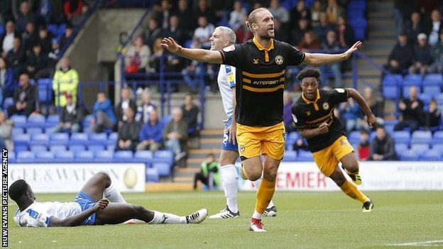 Frazier Franks of Newport County scores the first goal of the match