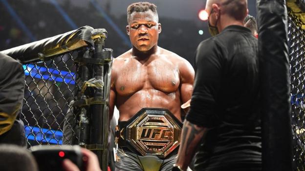 Francis Ngannou leaves the octagon after beating Ciryl Gane in 2022