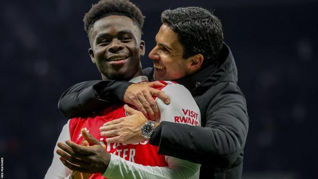 Mikel Areta hugs Arsenal star Bakayo Saka after a match