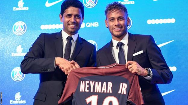 Neymar poses with the PSG shirt after joining the club in 2017