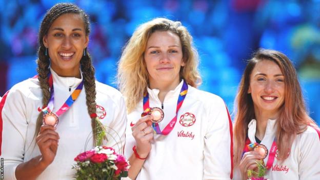 Geva Mentor, Jo Harten and Jade Clarke posing with bronze medals at the 2019 Netball World Cup in Liverpool