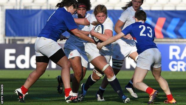 England's Poppy Cleall runs with the ball