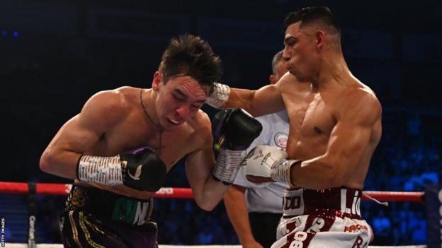 Lopez lands a shot on Conlan during their world title fight in May