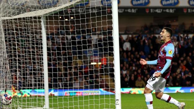 Anass Zaroury celebrates Manuel Benson's goal, which clinched the league   rubric  for Burnley