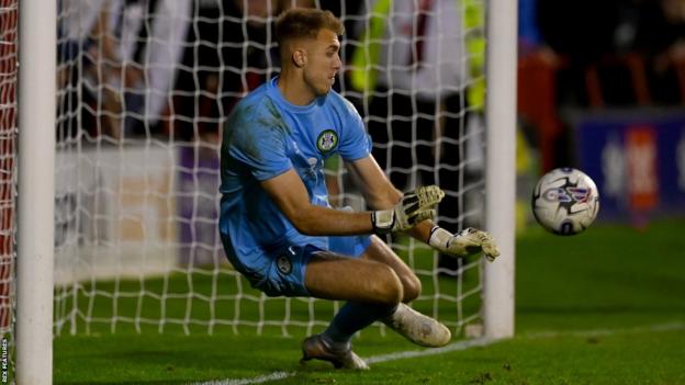 Jamie Searle saves a penalty for Forest Green Rovers