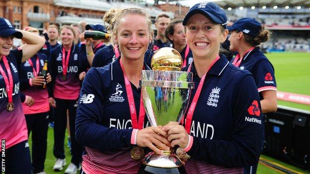 England batters Danni Wyatt (left) and Fran Wilson (right) smile as they hold up the 2017 World Cup trophy