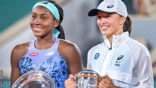 Coco Gauff and Iga Swiatek with their French Open trophies