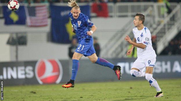 Kosovo's Bersant Celina and Croatia's Domagoj Vida