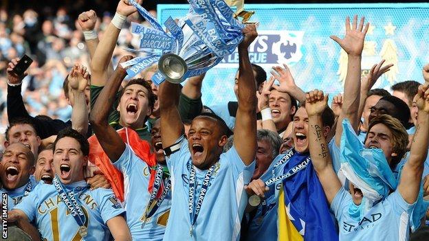 Manchester city captain Vincent Kompany and his team mates celebrate their Premier League success in 2012
