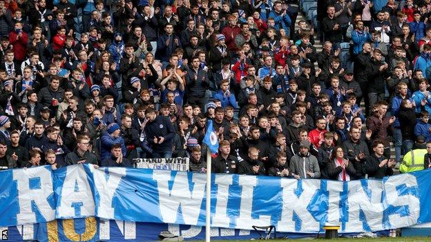 Rangers fans paid tribute to former player Ray Wilkins at Ibrox on Saturday