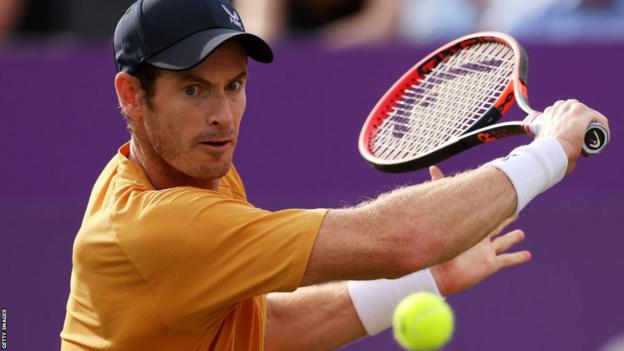Andy Murray hits a return at Queen's