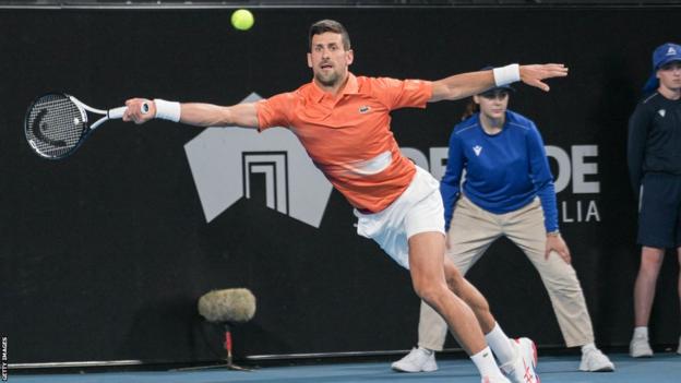 Novak Djokovic reaches for a forehand
