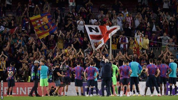 Barcelona players applaud their fans